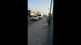 Dancing on Kew bridge in the sunlight