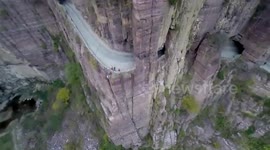 Drone video shows tunnel carved through mountain cliffs to Chinese village