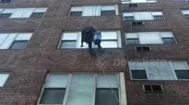 Window washer on the building in NY