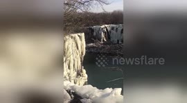 Veteran pro diver leaps from freezing 65ft-high waterfall