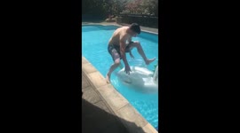 Man has 'inflatable fail' trying to jump on pool unicorn