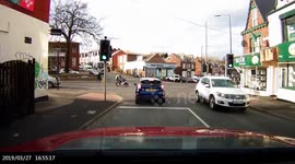 Multiple Cars. Vehicles going through a Red Traffic Lights