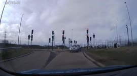 Woman tries to drive wrong way onto road