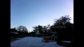 Unable to drive up snowy road.
