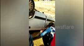 Two youth survives as their car toppled in Northern India.