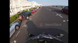Car speeds through speed camera and cuts off motorcycle