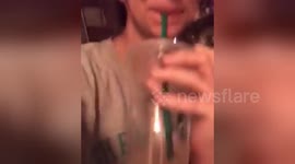 Newsflare Edit - Dog tries to drink out of Starbucks cup