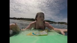 Brit woman's mission to clear Bali seas from plastic on her surfboard