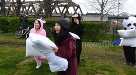 People injoy International Pillow fight in London, 2019