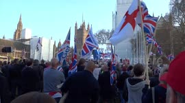 Crowds cheer the leader of Brexit party Nigel Farage MEP at the pro-Brexit rally in Parliament Square on 29 March 2019