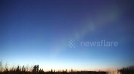 Twilight time Northern lights in the Canadian skies