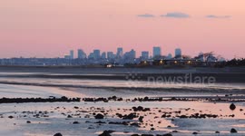 Twilight View of Boston Skyline With Beach