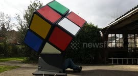 Ingenious UK man solves giant Rubik's Cube from the INSIDE