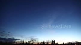 Clouded Sunset and the Northern Lights