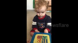 Baby gets scared of cuddly Jack-in-the-box surprise