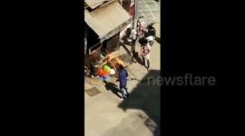 Terrified men scramble to put out LPG cylinder fire on Indian street