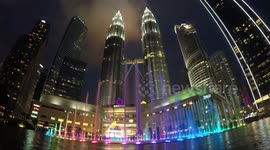 Timelapse in Kuala Lumpur from day to night at the Petronas towers n the city centre