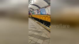 Check out the old-school engineering trains that speed through the London Underground at night