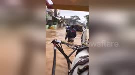 People forced to use horse-carts after streets in Indonesia are totally flooded