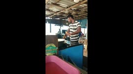 Indian chef tosses dough 20-ft up in the air to his partner without even looking at it while making Porottas (Flat Breads) in southern India