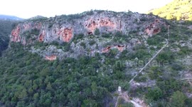 rock face zoom in shot with rock climber