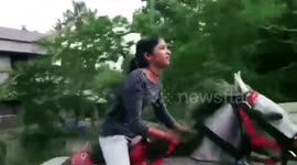 Girl in India decides to ride her horse to school