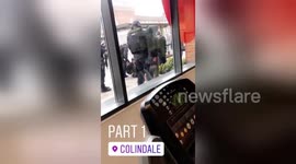 Police arrest youths and collect their gun from bush near McDonald's in London's Colindale