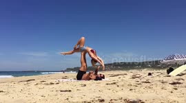 Aussie man makes surprise proposal to his girlfriend during beach 'acro-yoga'