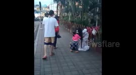 Ghost prank fails as little kids give kiss on the cheek to spooky prankster
