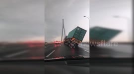 Powerful winds rip off building roof and push car into river in China