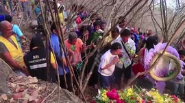 Tributes left to murdered backpacker as alleged killer's mother says he deserves the death penalty