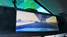Terrifying moment piece of STEEL hurtles through family's car windscreen