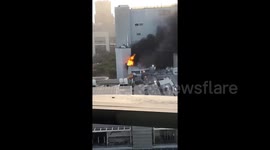 Flames seen rising from Bangkok hotel during lethal mall fire