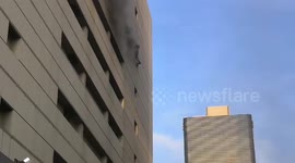 Man falls from eighth floor of burning Bangkok shopping mall trying to escape