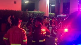 Emergency services remain on the scene of Bangkok hotel fire