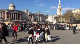The Hot Sun Shines Down On People In Trafalgar Square