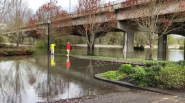Parking Lot In Oregon Is Flooded As Onlookers Watch