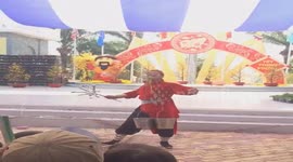 The unique performance of the man with swords, snakes, and buckets of water