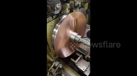 Hypnotic 'metal spinning' machine perfectly shapes copper disc into dome