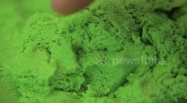 finger uncovering bitcoin from green