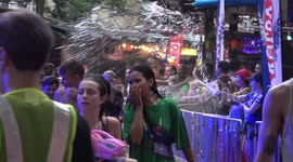 Thousands of tourists take part in 'world's biggest water fight' despite government ban