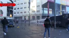 Dutch police fire water cannon at Ajax fans outside Johan Cruyff Arena