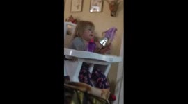 Ellie playing with her Popstar Barbie