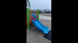 Ellie going down the slide her own way
