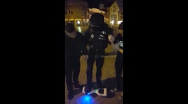 Policeman tries out hoverboard with some help