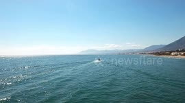 Catching up with Yacht sailing the Mediterranean sea off the coast of Spain - filmed from drone