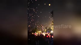 Thousands of lanterns fly into sky to celebrate New Year of China's Dai ethnic group