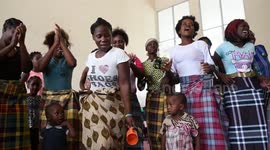 Cyclone Idai: Brief moment of joy as women celebrate donation of sarongs