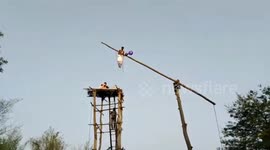 North Indian festival sees devotees puncture their flesh with hooks and walk on flames