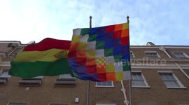 Bolivian flag waving in the wind at the entrance to the Embassy of Bolivia in London